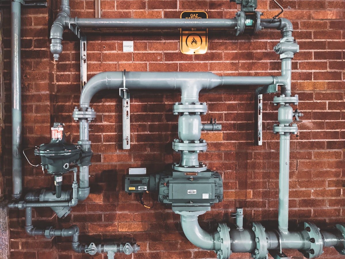 Freshly installed copper and brass supply lines in a mechanical room